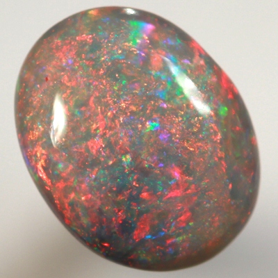 SOLID BLACK OPAL Top quality. Filled with bright red fire, high dome.  SEE VIDEO